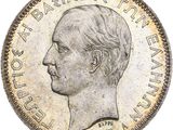 Gros plan sur une pièce de monnaie portant le visage d'un homme