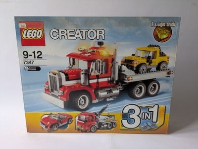 a box that has a lego creator truck in it