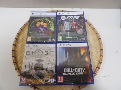 four video games are on a basket on a table