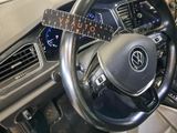 a steering wheel with a sticker on it in a car