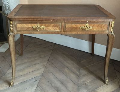 a wooden table with two drawers on it in a room