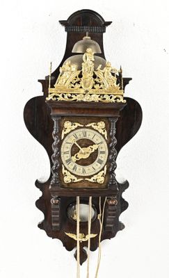 a clock that is hanging on the wall in the room