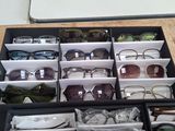 many pairs of glasses in a black case