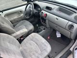 a small car with two seats and a steering wheel