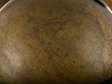 a large globe with a wooden handle on a table