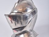 a silver metal helmet with a chainmail on top of it