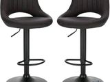 a pair of black leather bar stools on a white background