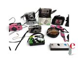 many different types of cameras that are on the table