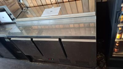 two refrigerators that are next to each other in a room