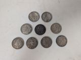 a lot of coins in the shape of a triangle