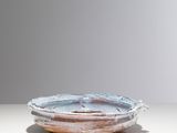 a plate that is sitting on a table with a white background