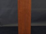 a wooden podium with a black background and a black backdrop