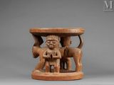 an image of a wooden table with a statue on top of it