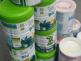 several containers of baby food are stacked on a table
