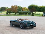 an image of a green sports car parked in a parking lot