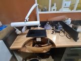 a desk with a chair and a computer on it