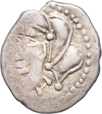 une pièce d'argent sur laquelle figure une tête de femme