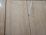 a piece of wood that has been cut off and is laying on the floor