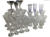 a lot of wine glasses that are sitting on a table
