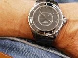 a man that is wearing a watch on his wrist
