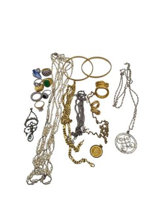 many different types of necklaces and bracelets on a white background