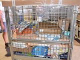 a man standing next to a cart with food in it