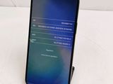 the back of a black samsung s9 phone with a display on it