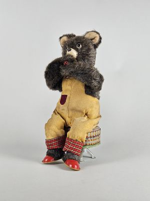 a teddy bear that is sitting on top of a chair