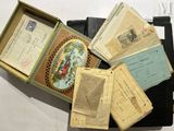 a lot of old envelopes in a box on a table