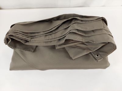 a stack of folded shirts sitting on a bed
