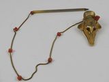 an image of a gold and red beaded necklace with a bird head on it