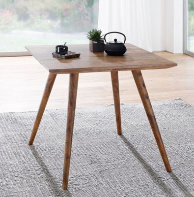 a small table with a tea pot on top of it