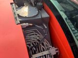 an image of a red truck with a bunch of wires