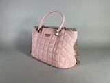 pink quilted handbag with gold chain strap