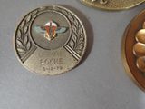 several medals are displayed on a table in a room