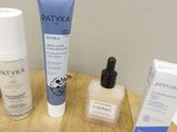 many different types of skin care products sitting on a table