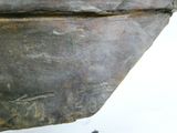 a close up of a piece of metal with writing on it