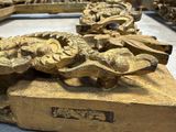 a lot of gold sculptures on display in a store
