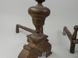 pair of antique cast iron coffee grinders and a cast iron bench
