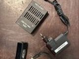 an image of a cell phone and charger on a table