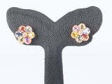 a close up of a pair of earrings on a black stand