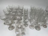 a lot of glasses that are sitting on a table