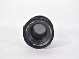 an image of a camera lens sitting on top of a white surface