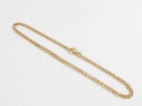 a gold necklace with a chain that is attached to it