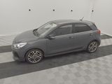 a picture of a grey car parked in a garage
