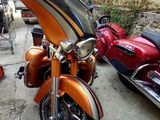 two motorcycles parked next to each other on the street