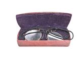 a pair of glasses in a case on a white background