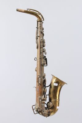 an old brass saxophone with a white background and a white background