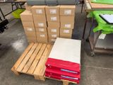 a pile of boxes on a pallet next to a stack of boxes
