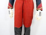 a close up of a mannequin dressed in red pants and a blue jacket